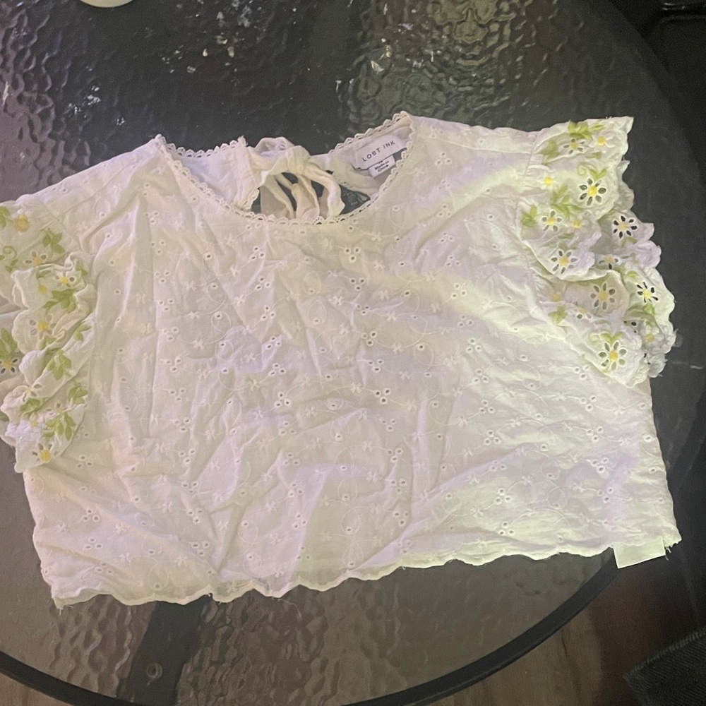 Chic White Eyelet Blouse with Green Floral Accents